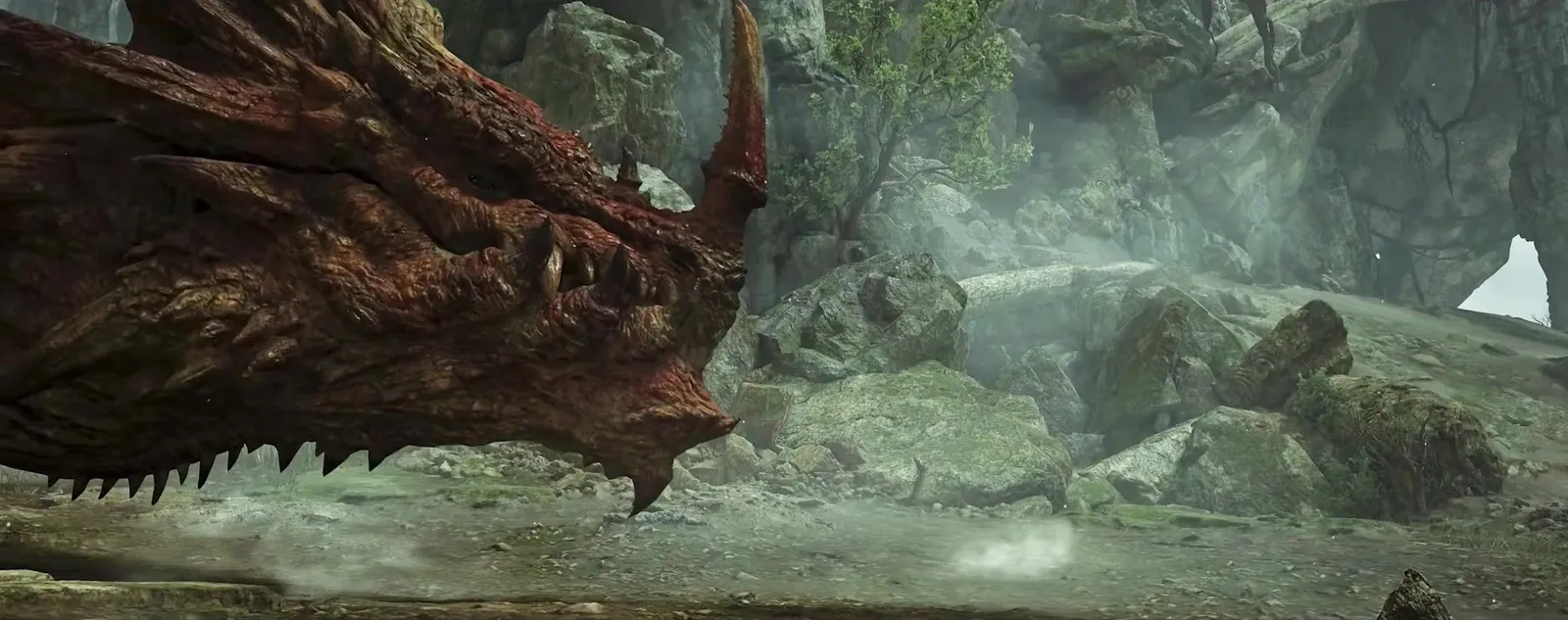 Close-up of Lao-Shan Lung’s horned red head in a misty mossy canyon in the Monster Hunter Wilds Ascendance trailer