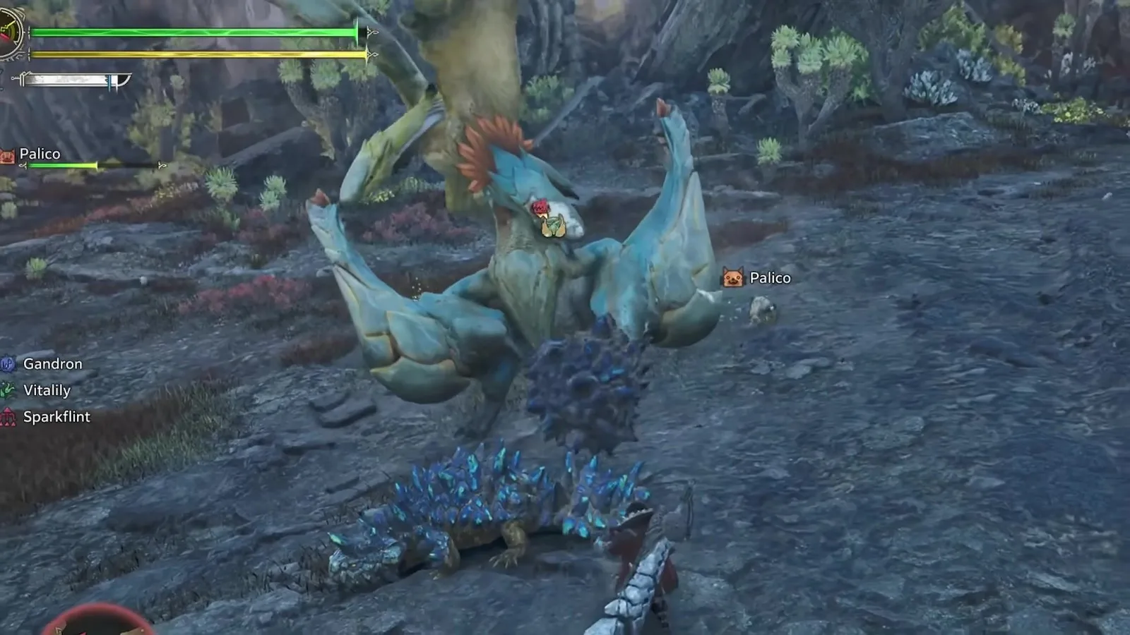 Araketa rearing over a crystal-spiked Gandron in Monster Hunter Wilds Ascendance, the HUD listing Gandron, Vitalily and Sparkflint