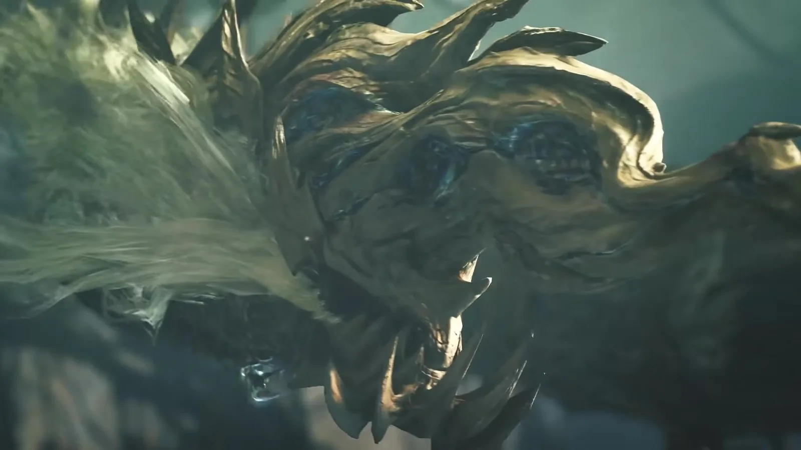 Close-up of Gundoraja’s gold and bronze face and flowing mane with its fangs bared, from the Monster Hunter Wilds Ascendance trailer