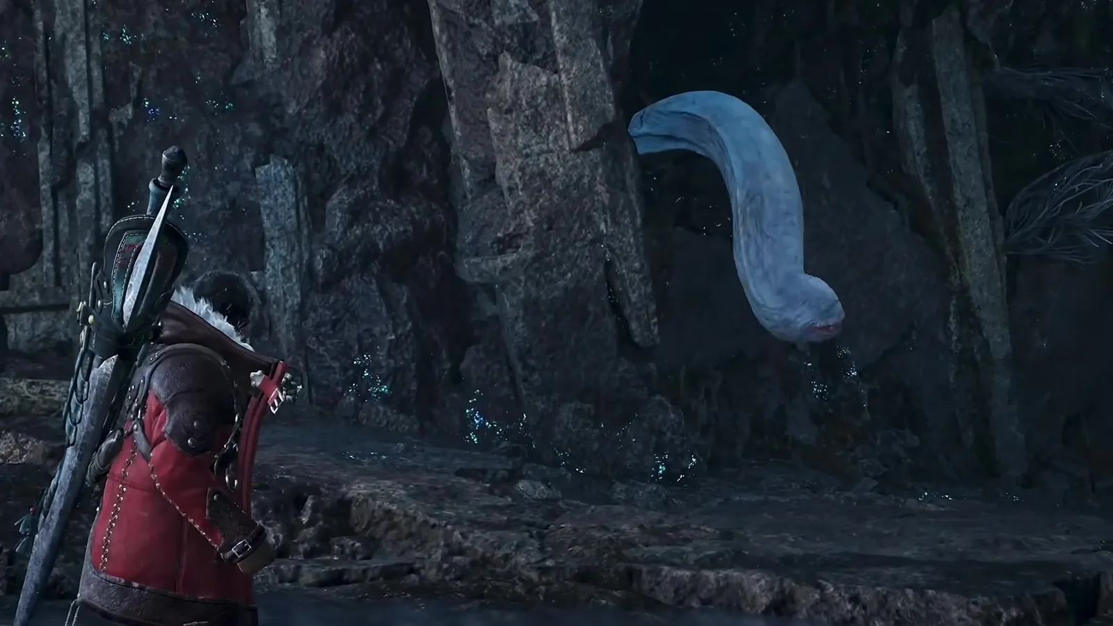 Khezu’s pale neck and head reaching out of a hole in a ruined stone wall beside a red-coated hunter in Monster Hunter Wilds Ascendance