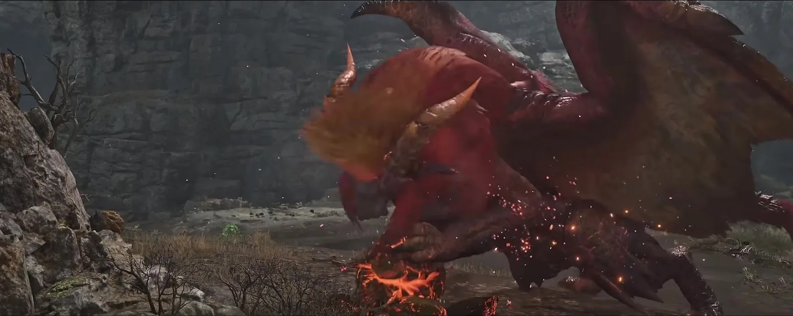 Teostra in Monster Hunter Wilds Ascendance crouched over a glowing blast core in a rocky canyon, flames licking its red mane